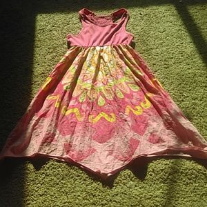 A Flowy pink dress, with accents of spring colors